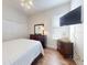 Comfortable bedroom with a ceiling fan and dark wood furniture providing a serene and relaxing retreat at 6665 Merryvale Ln, Port Orange, FL 32128