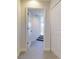 Hallway features neutral walls, carpeted floors, and white doors at 6665 Merryvale Ln, Port Orange, FL 32128