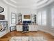 Home office with built-in shelving, a ceiling fan, and beautiful wood floors at 6665 Merryvale Ln, Port Orange, FL 32128