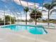 Relaxing pool area features a screened enclosure, spa, and peaceful lake views for the ultimate leisure experience at 6665 Merryvale Ln, Port Orange, FL 32128