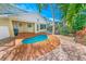 Backyard boasts an in-ground pool and outdoor seating deck, perfect for relaxation and entertainment at 72 Oceanview Ave, Ponce Inlet, FL 32127