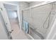 Clean bathroom featuring a tiled shower/tub combo, with a view into an adjacent bedroom at 72 Oceanview Ave, Ponce Inlet, FL 32127