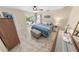 Cozy bedroom with ensuite patio access, neutral tones, and updated tile floors at 72 Oceanview Ave, Ponce Inlet, FL 32127