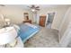 Bedroom with neutral walls, ceiling fan, and tiled floors plus an ensuite bathroom at 72 Oceanview Ave, Ponce Inlet, FL 32127