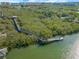 Aerial view of long community boardwalk and fishing pier offering views of the surrounding nature preserve at 72 Oceanview Ave, Ponce Inlet, FL 32127