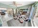Sunroom with cozy seating, windows, and access to dining area and outdoor views at 72 Oceanview Ave, Ponce Inlet, FL 32127