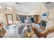 Living room area with fireplace, tile floor, and comfortable seating at 72 Oceanview Ave, Ponce Inlet, FL 32127