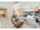 Spacious living room with fireplace, tile flooring, and plenty of natural light at 72 Oceanview Ave, Ponce Inlet, FL 32127