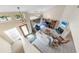 Bright, open living room with vaulted ceilings, a fireplace, and large windows overlooking the street at 72 Oceanview Ave, Ponce Inlet, FL 32127