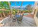 Outdoor deck offers a table with seating under a blue and white striped umbrella at 72 Oceanview Ave, Ponce Inlet, FL 32127