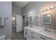 Well-lit bathroom with modern fixtures, double sinks and decorative accents for a spa-like experience at 731 Pine Shores Cir, New Smyrna Beach, FL 32168