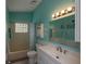 Bright bathroom with modern vanity, neutral colors, and stylish fixtures at 731 Pine Shores Cir, New Smyrna Beach, FL 32168