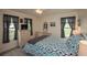 Comfortable bedroom with neutral colors, stylish furnishings, and lots of natural light at 731 Pine Shores Cir, New Smyrna Beach, FL 32168