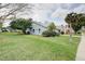 Well-maintained home with tidy landscaping, complemented by mature trees and a spacious lawn at 731 Pine Shores Cir, New Smyrna Beach, FL 32168