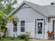 Close up of the home's front entrance showcasing the white brickwork and decorative wreath on the front door at 731 Pine Shores Cir, New Smyrna Beach, FL 32168