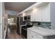 Modern kitchen featuring stainless steel appliances, updated cabinets, and marble counter tops at 731 Pine Shores Cir, New Smyrna Beach, FL 32168