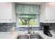 Bright kitchen featuring modern counter tops and decorative backsplash at 731 Pine Shores Cir, New Smyrna Beach, FL 32168