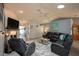 Open living room with fireplace, flatscreen TV, and view of adjacent rooms at 731 Pine Shores Cir, New Smyrna Beach, FL 32168