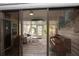 Inviting sun room featuring a sliding glass door that gives access to the living area of the home at 731 Pine Shores Cir, New Smyrna Beach, FL 32168