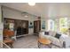 Inviting sun room boasts lots of light, comfortable seating and access to outdoors at 731 Pine Shores Cir, New Smyrna Beach, FL 32168