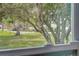Window view with well manicured front lawn and landscaping at 731 Pine Shores Cir, New Smyrna Beach, FL 32168