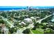 Scenic aerial view of a coastal community with lush greenery, single-Gathering homes, and an oceanfront skyline in the background at 746 N Halifax Ave, Daytona Beach, FL 32118