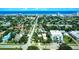 Coastal town aerial showcasing tree-lined streets, single-Gathering homes, and ocean views with a beautiful horizon at 746 N Halifax Ave, Daytona Beach, FL 32118