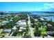 Wide aerial view of a coastal city featuring tree-lined streets, bridges, the ocean, and a vibrant skyline under blue skies at 746 N Halifax Ave, Daytona Beach, FL 32118