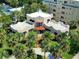 Beautiful Mediterranean-style home featuring mature palm trees, a red tile roof, and a spacious layout at 746 N Halifax Ave, Daytona Beach, FL 32118