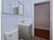 Clean bathroom featuring a vanity with storage, tiled floors, and new fixtures at 746 N Halifax Ave, Daytona Beach, FL 32118