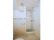 A bathroom with a tiled shower and neutral decor at 746 N Halifax Ave, Daytona Beach, FL 32118