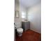 A cozy half bath with white fixtures, gray vanity, and charming tile flooring at 746 N Halifax Ave, Daytona Beach, FL 32118