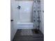 Clean and functional bathroom with tile surround and updated flooring at 746 N Halifax Ave, Daytona Beach, FL 32118