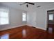 Bedroom with refinished hardwood floors and large windows at 746 N Halifax Ave, Daytona Beach, FL 32118