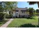 This cozy home boasts a manicured lawn and inviting front entrance at 746 N Halifax Ave, Daytona Beach, FL 32118