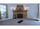 Close-up of the stone fireplace in the living room, complete with mantel and decor at 746 N Halifax Ave, Daytona Beach, FL 32118