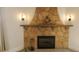 Detailed view of the stone fireplace with a decorative mantel and hearth at 746 N Halifax Ave, Daytona Beach, FL 32118