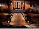 Inviting home entrance at night with landscape lighting illuminating the walkway and the home's facade at 746 N Halifax Ave, Daytona Beach, FL 32118