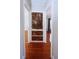 Hallway with a unique built-in distressed cabinet, and hardwood floors at 746 N Halifax Ave, Daytona Beach, FL 32118