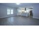 Bright kitchen features white cabinets, stainless steel appliances and large center island with seating at 746 N Halifax Ave, Daytona Beach, FL 32118