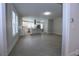 Bright kitchen features white cabinets, stainless steel appliances and large center island with seating at 746 N Halifax Ave, Daytona Beach, FL 32118