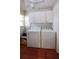 Laundry room with washer, dryer, storage, and tile flooring at 746 N Halifax Ave, Daytona Beach, FL 32118
