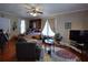 Living room with hardwood floors, sofa, TV, and decorative rug at 746 N Halifax Ave, Daytona Beach, FL 32118