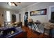 Living room with hardwood floors and an adjacent kitchenette at 746 N Halifax Ave, Daytona Beach, FL 32118