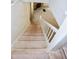 Staircase descends into living area featuring fireplace and carpet at 746 N Halifax Ave, Daytona Beach, FL 32118
