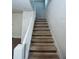 Traditional wooden staircase with white banister in a cozy setting at 746 N Halifax Ave, Daytona Beach, FL 32118