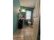 This bathroom features a toilet, pedestal sink, and a shower behind a white door at 812 Marion St, Daytona Beach, FL 32114