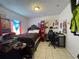 Bedroom featuring a bed, desk, anime-themed decor, and flags displayed on the window at 812 Marion St, Daytona Beach, FL 32114