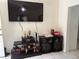 Living room with a TV mounted on the wall and a stereo system on the shelf at 812 Marion St, Daytona Beach, FL 32114