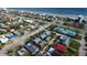 An aerial view showcases this charming beach community close to the ocean and local amenities at 835 E 24Th Ave # 111, New Smyrna Beach, FL 32169